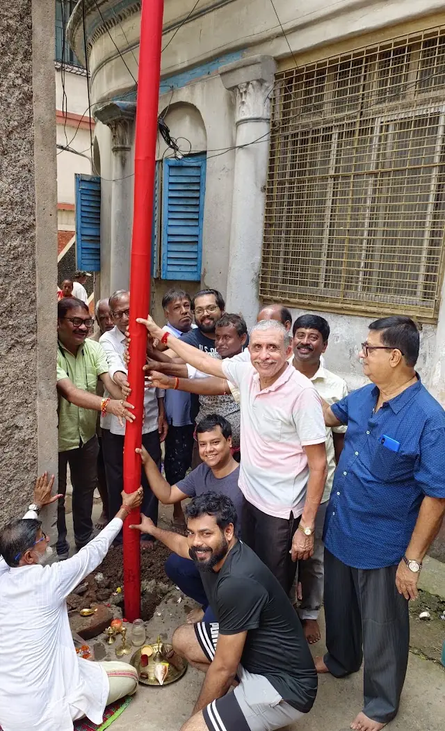 Committee members and neighbours at the khuti puja