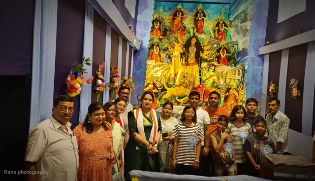 Neighbours and visitors gather at the pandal on Maha Shashthi (photo: Rana Photography)