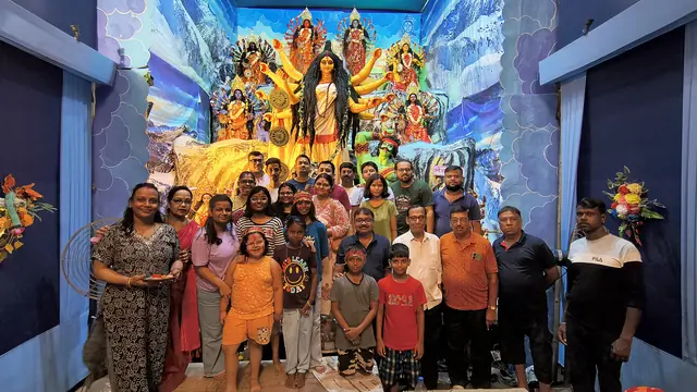 Members and families together before the goddess on Bijoya Dashami evening