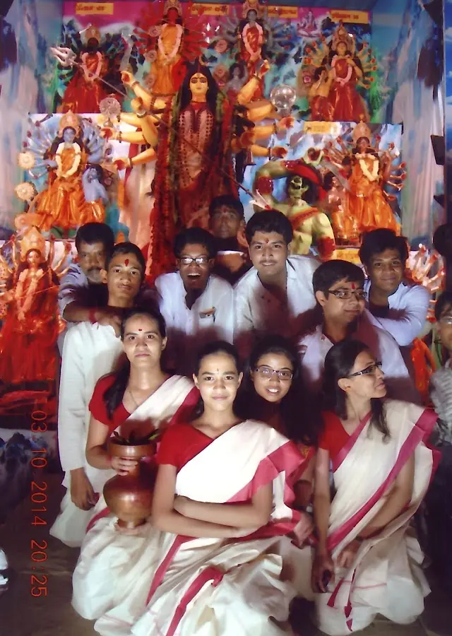 Devotees in red-bordered saris
