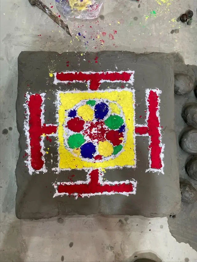 Alpana drawn for the puja
