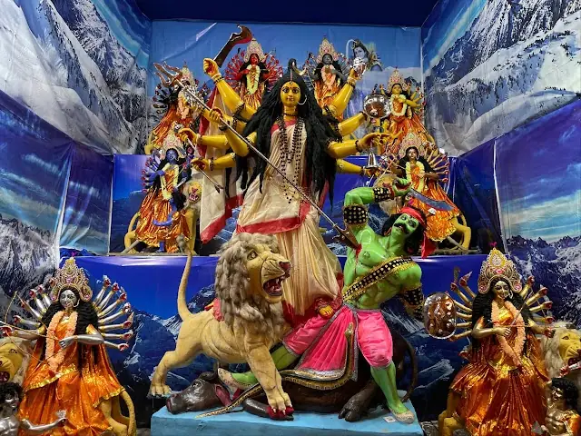 The full Naba Durga ensemble against a Himalayan backdrop